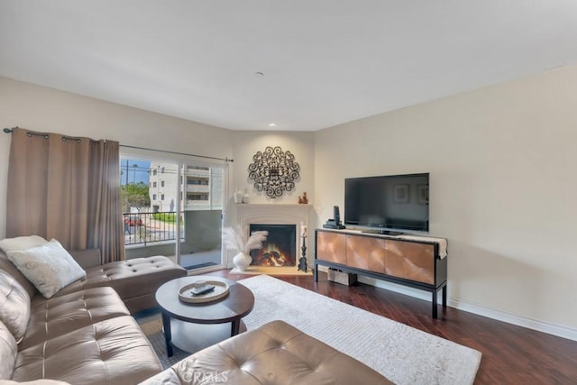 13200 Moorpark St Unit 201, Sherman Oaks, CA 91423 - living area with wood finished floors, baseboards, and a warm lit fireplace