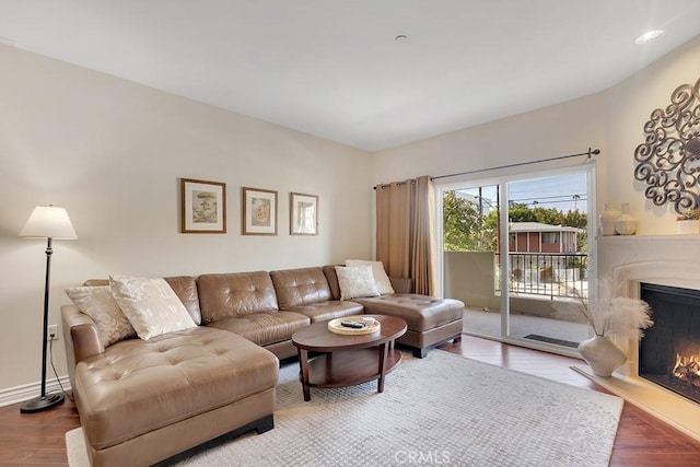 13200 Moorpark St Unit 201, Sherman Oaks, CA 91423 - living area featuring a lit fireplace and wood finished floors