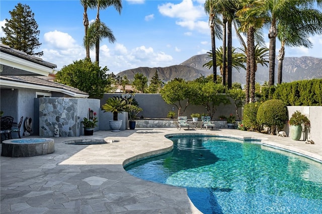 1738 N Ukiah Way, Upland, CA 91784 - view of swimming pool featuring a mountain view, a patio, and a fenced backyard
