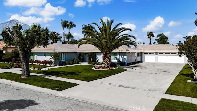 1738 N Ukiah Way, Upland, CA 91784 - ranch-style home featuring driveway, an attached garage, a front yard, stucco siding, and a tiled roof