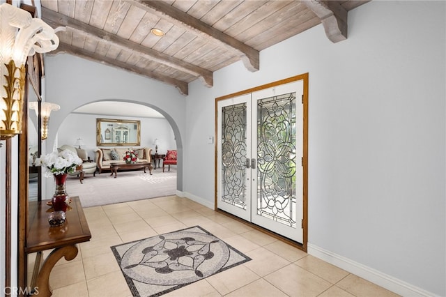 1738 N Ukiah Way, Upland, CA 91784 - foyer entrance featuring arched walkways, french doors, wood ceiling, light tile patterned floors, and baseboards