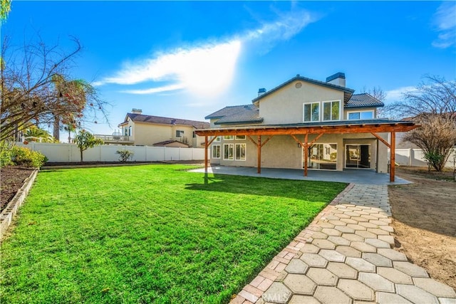 31832 Poole Ct, Temecula, CA 92591 - back of house with stucco siding, a patio area, and a chimney