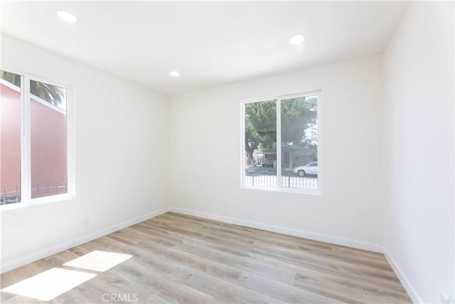 1342 W Magnolia St, Compton, CA 90220 - spare room featuring light wood-style flooring, recessed lighting, and baseboards