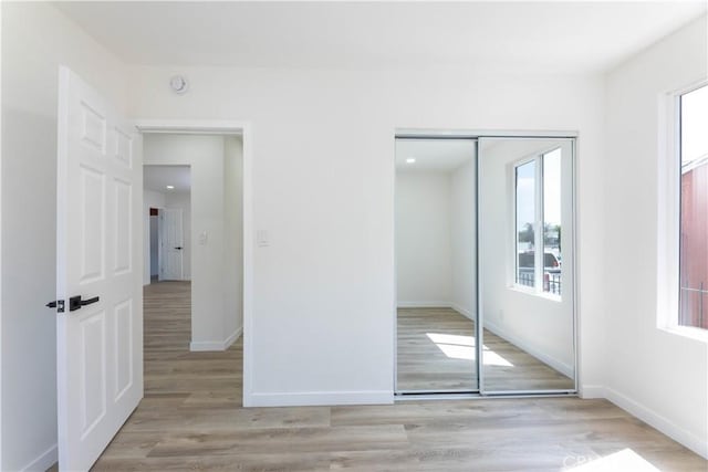 1342 W Magnolia St, Compton, CA 90220 - unfurnished bedroom with multiple windows, a closet, and baseboards