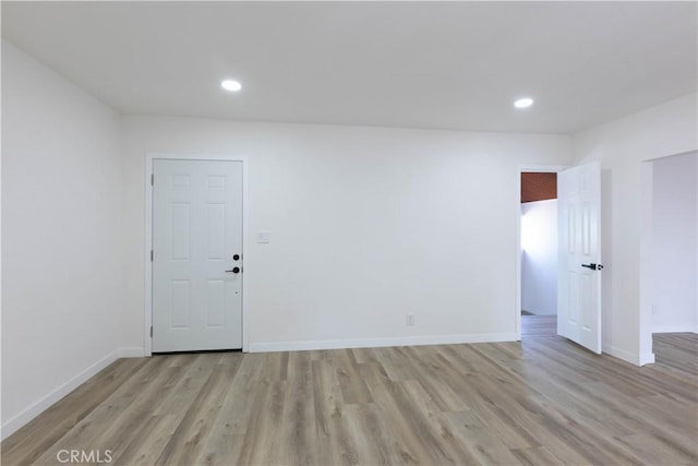 1342 W Magnolia St, Compton, CA 90220 - empty room with light wood finished floors, baseboards, and recessed lighting