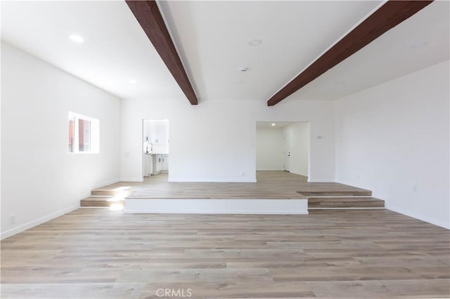 1342 W Magnolia St, Compton, CA 90220 - unfurnished living room featuring beamed ceiling, light wood-type flooring, recessed lighting, and baseboards