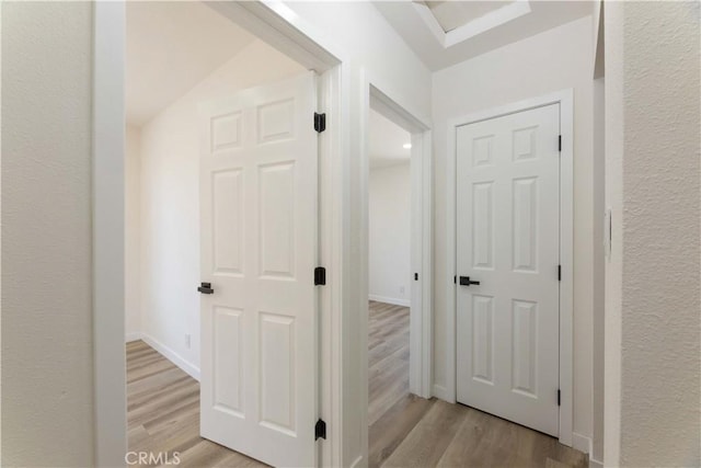 1342 W Magnolia St, Compton, CA 90220 - hall with light wood finished floors and a textured wall