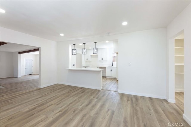 1342 W Magnolia St, Compton, CA 90220 - unfurnished living room featuring light wood-type flooring, recessed lighting, and baseboards