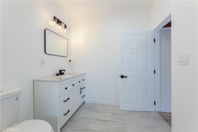 1342 W Magnolia St, Compton, CA 90220 - bathroom with vanity, toilet, and marble look tile flooring