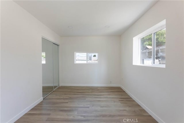 1342 W Magnolia St, Compton, CA 90220 - empty room featuring wood finished floors and baseboards