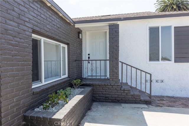 1342 W Magnolia St, Compton, CA 90220 - doorway to property with stucco siding