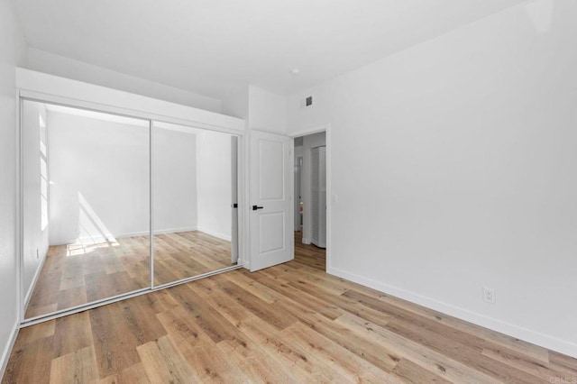 3581 Cameo Dr Unit 35, Oceanside, CA 92056 - unfurnished bedroom featuring wood finished floors and a closet