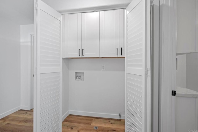 3581 Cameo Dr Unit 35, Oceanside, CA 92056 - laundry area with cabinet space, wood finished floors, and hookup for a washing machine