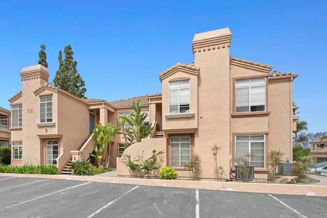 3581 Cameo Dr Unit 35, Oceanside, CA 92056 - view of property featuring uncovered parking