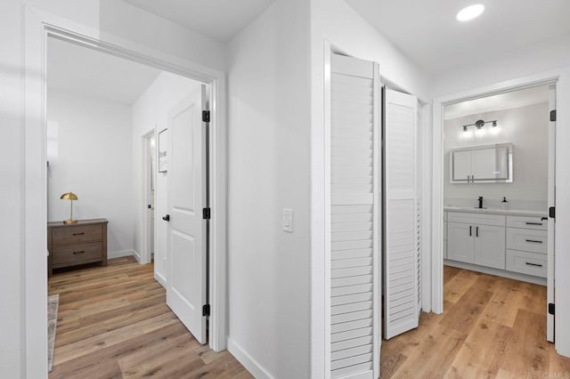 3581 Cameo Dr Unit 35, Oceanside, CA 92056 - hallway featuring light wood-style floors and baseboards