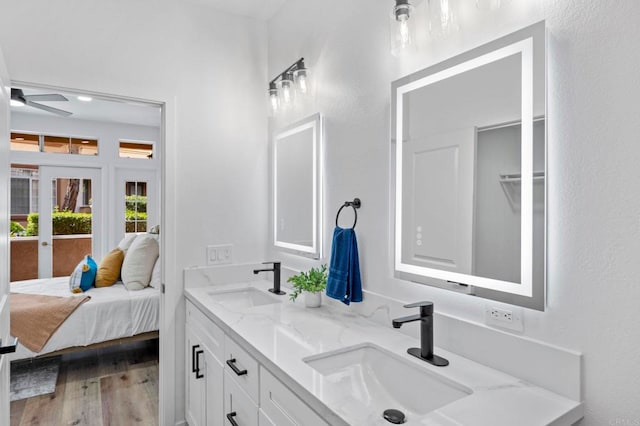 3581 Cameo Dr Unit 35, Oceanside, CA 92056 - ensuite bathroom with double vanity, wood finished floors, a ceiling fan, and french doors