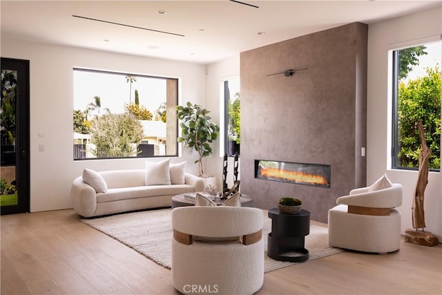 16828 Otsego St, Encino, CA 91436 - living room with wood finished floors, a fireplace, and healthy amount of natural light