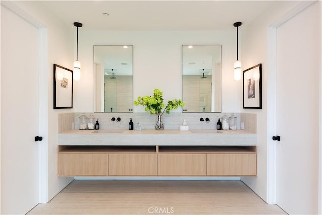 16828 Otsego St, Encino, CA 91436 - full bath with double vanity, tasteful backsplash, a shower, and wood finished floors
