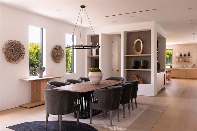 16828 Otsego St, Encino, CA 91436 - dining room featuring light wood-style floors and a chandelier