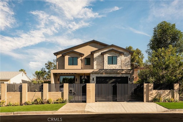 16828 Otsego St, Encino, CA 91436 - contemporary house featuring driveway, stone siding, a fenced front yard, stucco siding, and an attached garage