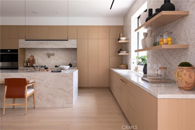 16828 Otsego St, Encino, CA 91436 - kitchen with open shelves, a sink, modern cabinets, light wood-style flooring, and stainless steel double oven