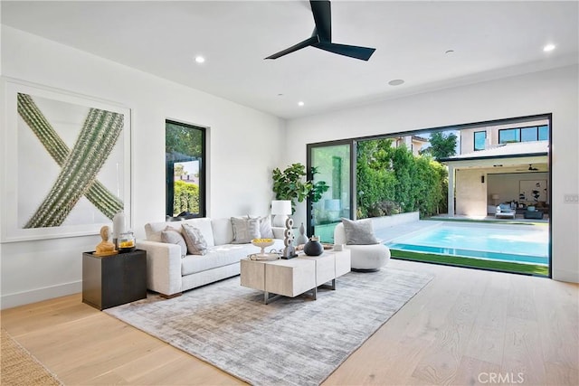 16828 Otsego St, Encino, CA 91436 - living area featuring wood finished floors, healthy amount of natural light, a ceiling fan, recessed lighting, and baseboards