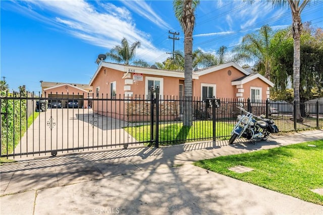 660 W 94th St, Los Angeles, CA 90044 - view of front of home with stucco siding and a gate