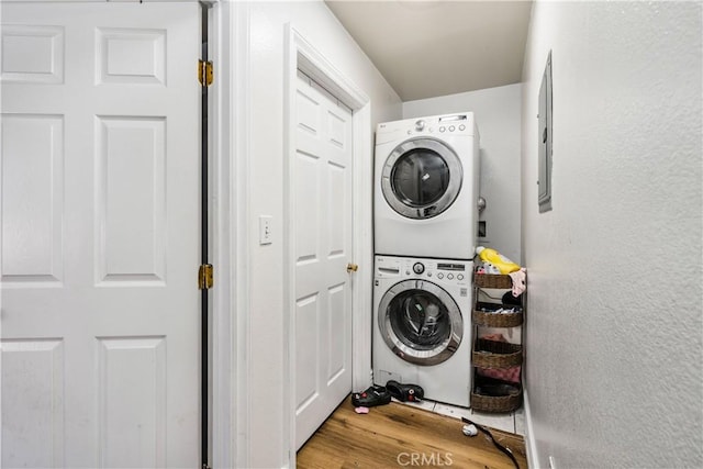 660 W 94th St, Los Angeles, CA 90044 - laundry room with estacked washer and dryer and wood finished floors