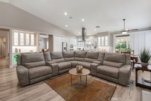 6530 Encina St, Chino, CA 91710 - living room with light wood finished floors, ceiling fan, recessed lighting, and high vaulted ceiling