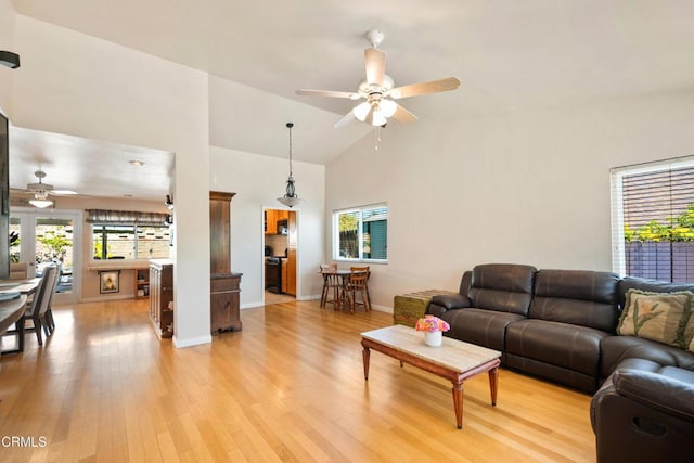 27585 Pamplico Dr, Valencia, CA 91354 - living area with ceiling fan, light wood-style floors, high vaulted ceiling, and baseboards