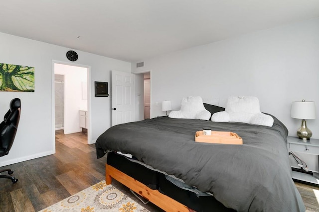 11855 Caminito Ronaldo Unit 108, San Diego, CA 92128 - bedroom with wood finished floors, baseboards, and ensuite bath