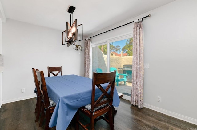 11855 Caminito Ronaldo Unit 108, San Diego, CA 92128 - dining room with dark wood-type flooring, baseboards, and a chandelier
