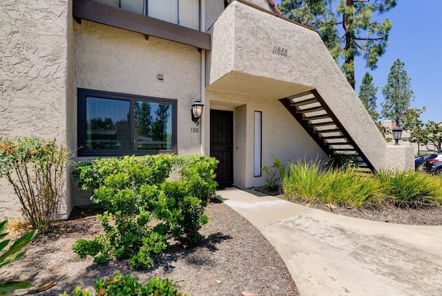 11855 Caminito Ronaldo Unit 108, San Diego, CA 92128 - entrance to property with stucco siding