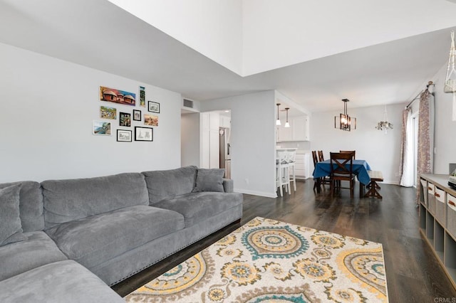 11855 Caminito Ronaldo Unit 108, San Diego, CA 92128 - living area with dark wood-style flooring and a chandelier