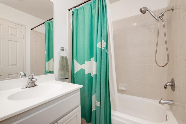 11855 Caminito Ronaldo Unit 108, San Diego, CA 92128 - bathroom with shower / bath combo with shower curtain and vanity