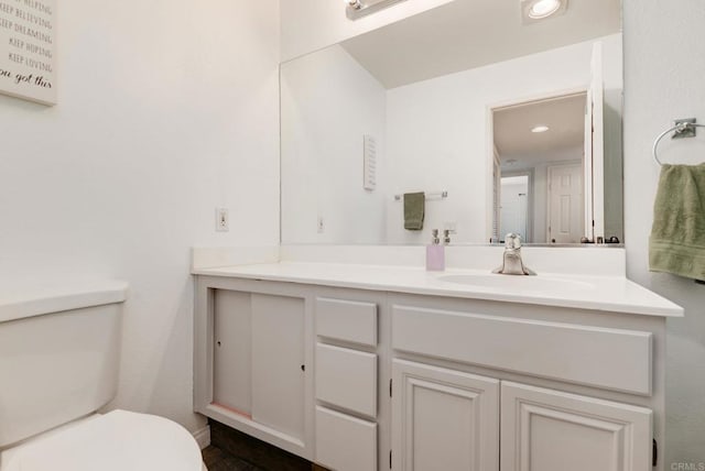 11855 Caminito Ronaldo Unit 108, San Diego, CA 92128 - bathroom with toilet, vanity, and recessed lighting