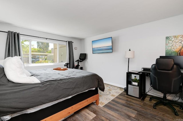 11855 Caminito Ronaldo Unit 108, San Diego, CA 92128 - bedroom with wood finished floors, baseboards, and an office area
