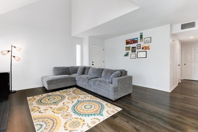 11855 Caminito Ronaldo Unit 108, San Diego, CA 92128 - living room featuring dark wood-style flooring, baseboards, and a high ceiling