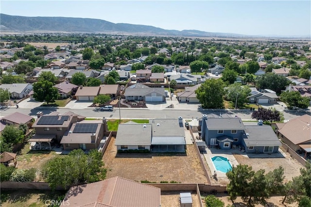42330 61st St W, Lancaster, CA 93536 - aerial perspective of suburban area featuring a mountain backdrop and a pool area