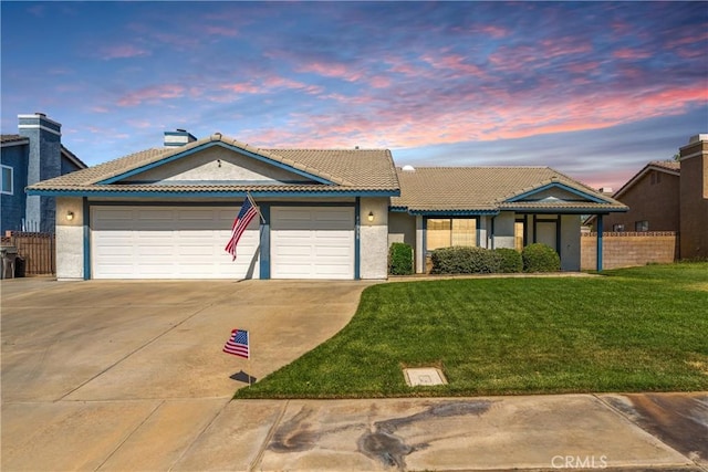 42330 61st St W, Lancaster, CA 93536 - view of front of home with driveway, an attached garage, stucco siding, and a tile roof