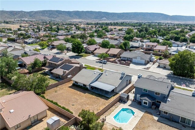 42330 61st St W, Lancaster, CA 93536 - aerial view of residential area with a mountain backdrop and a pool
