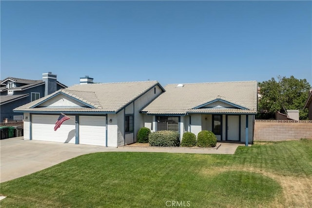 42330 61st St W, Lancaster, CA 93536 - view of front of property featuring a garage, a tile roof, concrete driveway, and stucco siding