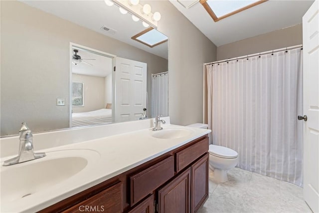 42330 61st St W, Lancaster, CA 93536 - full bath featuring toilet, double vanity, ensuite bathroom, and tile patterned floors