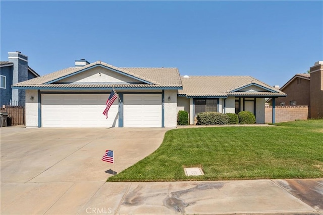 42330 61st St W, Lancaster, CA 93536 - view of front of home with concrete driveway, an attached garage, stucco siding, and a tiled roof