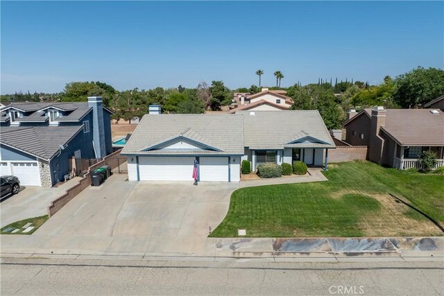 42330 61st St W, Lancaster, CA 93536 - view of front of house featuring a garage, concrete driveway, a tile roof, and a residential view