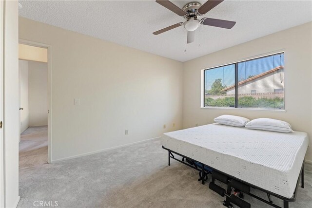 42330 61st St W, Lancaster, CA 93536 - bedroom featuring light colored carpet, a ceiling fan, and baseboards