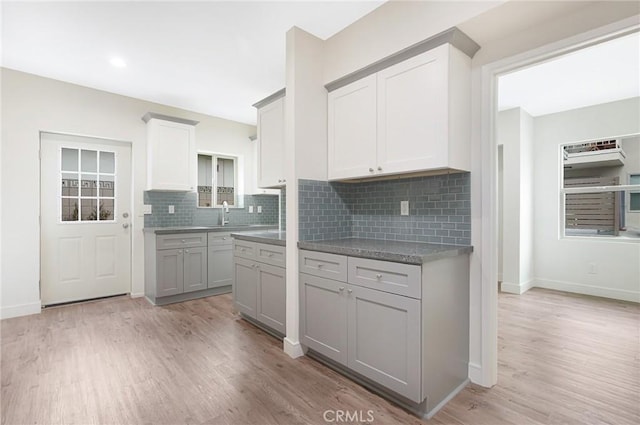 4612 W 132nd St, Hawthorne, CA 90250 - kitchen featuring light wood-style floors, backsplash, and baseboards