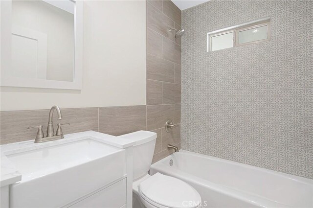 4612 W 132nd St, Hawthorne, CA 90250 - bathroom with toilet, vanity,  shower combination, and tile walls