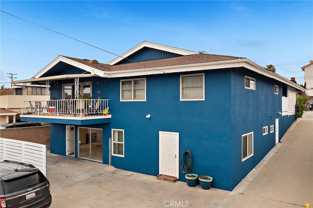 4612 W 132nd St, Hawthorne, CA 90250 - rear view of house featuring a balcony, stucco siding, and a patio area