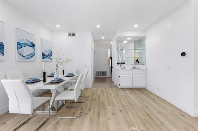 14121 Exeter Ct, Fontana, CA 92336 - dining space featuring light wood-type flooring, recessed lighting, baseboards, and ornamental molding